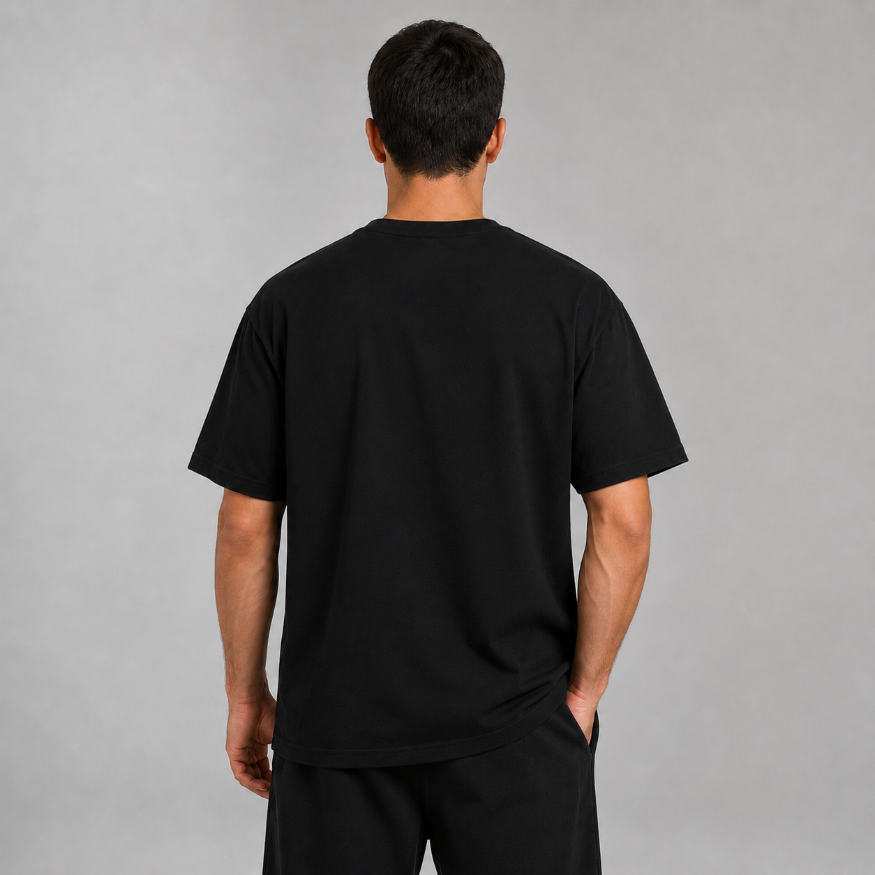 1. Back view of a model wearing the black Kitsune Spirit T-shirt