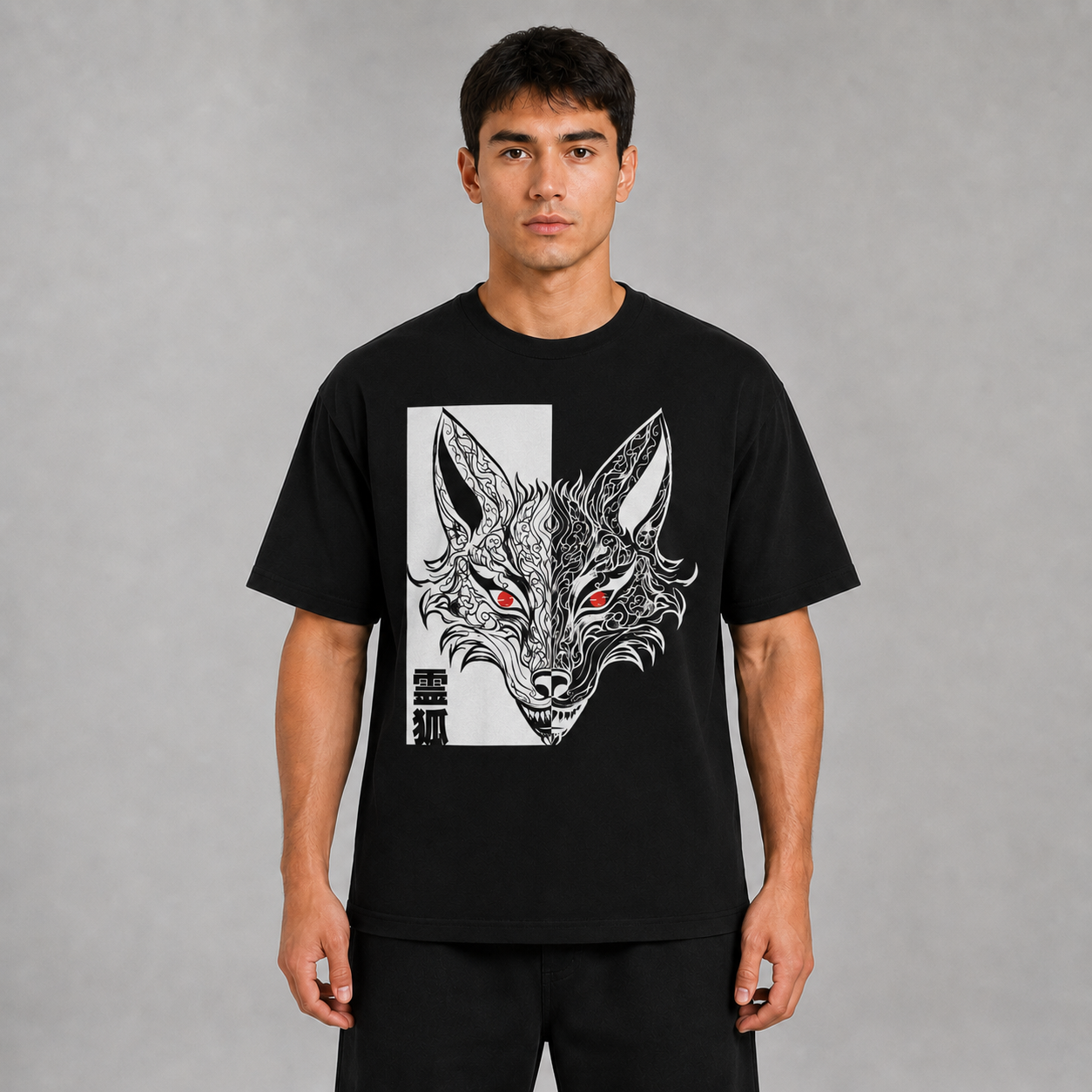 Front view of a model wearing the black Kitsune Spirit T-shirt with symmetrical fox artwork