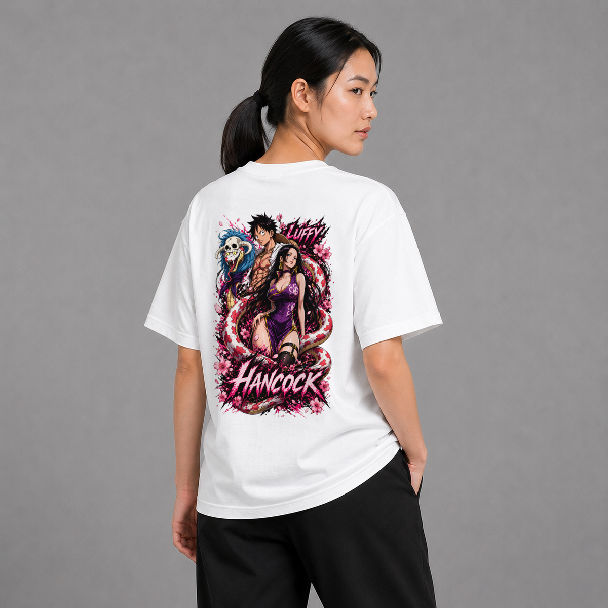 Back view of a model wearing the white Boa Hancock and Luffy T-shirt inspired by One Piece
