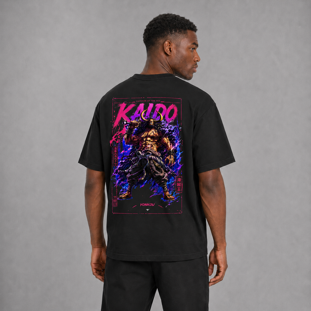 Back view of a model wearing the black Kaido Beast Emperor T-shirt inspired by One Piece